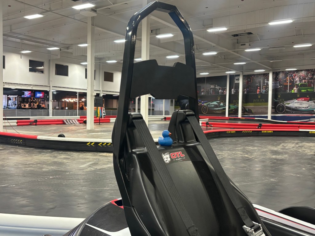 A K1 go-kart track in New Orleans, featuring a blue rubber ducky on top of a go-kart seat.